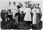 William is standing, third from left. Lucy is front right, probably holding her daughter June. Standing fourth from left is Alice Cater (granddaughter of Thomas Jefferson Bundy), and standing leftmost is Savilla (Bundy) Russell.  (Original: Janet Lucius)