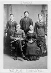 Bundy family, circa 1880, based on Francis appearing to be about 18. William and Emeline Bundy in front. Although the top of the picture is captioned "Wesley", it must be Francis in the back. The two young ladies must be the sisters Julia and Savilla, and Julia would have been only 13 years old when Wesley died in 1872, but both sisters definitely look older than 13 in this picture. The sister on the right is probably Savilla, as family tradition holds that Savilla and Esther looked alike, and Mary Hundeby thinks the sister on the right looks like Esther. (Original: Janet Lucius)