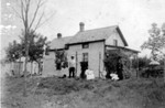 Alex standing, then Marie in rocking chair holding Elmer, Ed, Rose, and Jeanette (sister of Alex).  Taken on the family farm at Grey Cloud Island, 1897.