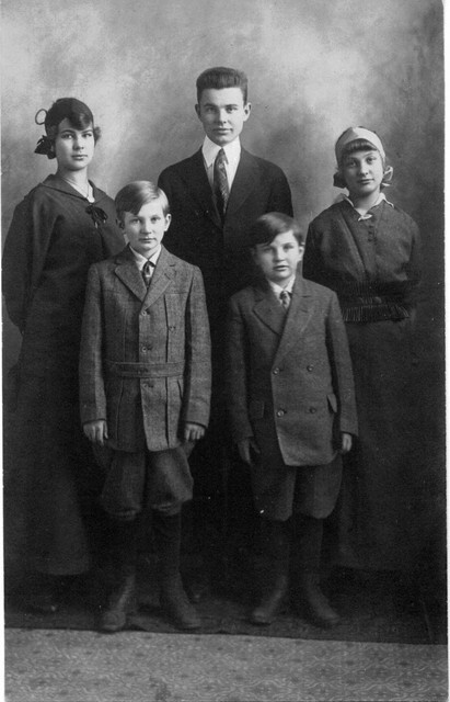 Comparing the carpeting and floorwork in this picture with the previous one, we see they are the same. We also see that the oldest daughter looks very much like Edith, and the woman on the left looks like the two previous pictures of Mary. So this is the family of Charles Olson and Mary (Mattson) Olson, around 1915. The children (oldest to youngest) are Edith, Carl and Robert.