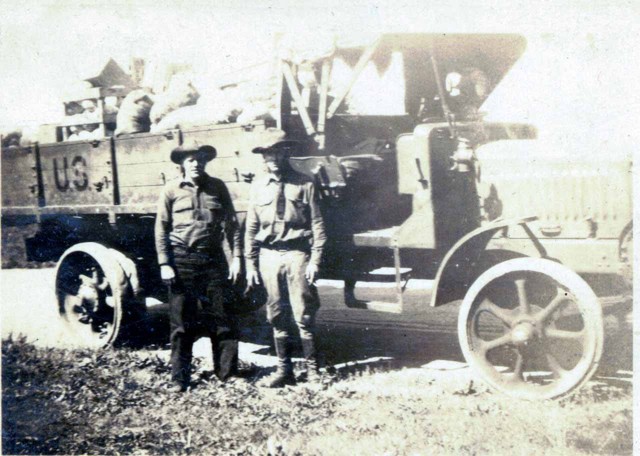 Looks like Bob on the left, unknown on the right, appears to be a U.S. Army truck.  Back of photo stamped "Paramount Photo Shop, La Crosse, Wisonsin." Probably from his time working in the Civilian Conservation Corps. (Original: Bob Hart, from Bob Winberg's Photo Album)