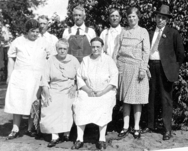 Birthday celebration for Freda (Winberg) LaBathe, around 1927.  In front are the two sisters, Marie on the left, and Freda on the right.  In back, from left to right, are Clara (wife of Charles), Charles, Alex LaBathe (husband of Marie), Oliver LaBathe (husband of Freda),  Ingeborg, (wife of Fred) and Fred Winberg.   Photograph taken on Freda's birthday, according to an annotation found on another photograph from this same event. (Original: Bob Hart, from Bob Winberg's photo album)